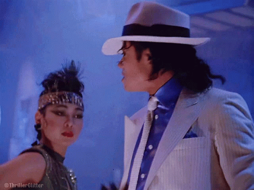 White Suit And Hat Man Dancing With Woman GIF