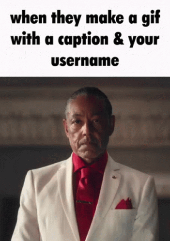 Man In White Suit And Red Tie With Caption GIF