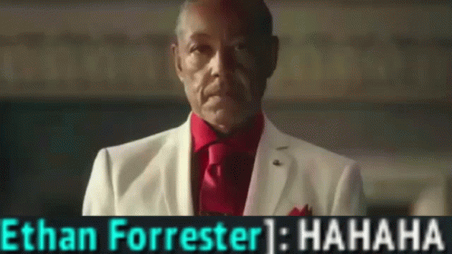 A Man In A White Suit And Red Tie With The Name Ethan Forrester On The Bottom GIF