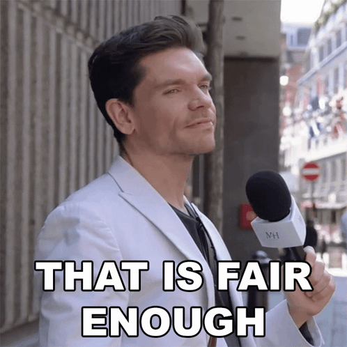 A Man In A White Suit Is Holding A Microphone And Says " That Is Fair Enough " GIF