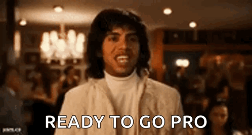 A Man In A White Suit Is Ready To Go Pro In A Restaurant . GIF