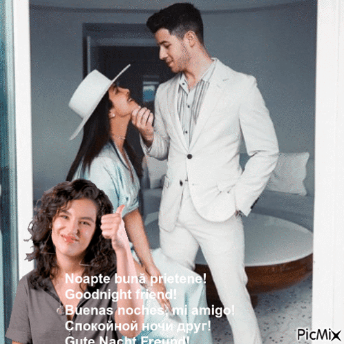 A Man In A White Suit Is Standing Next To A Woman In A Hat And Giving A Thumbs Up GIF