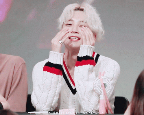 A Man In A White Sweater Covering His Face With His Hands With The Words Sweet Ever Bitter Never Below Him GIF