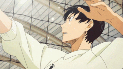 A Man In A White Sweatshirt With A Footprint On It Is Jumping Over A Volleyball Net GIF