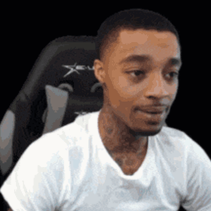 A Man In A White T-Shirt Is Sitting In A Gaming Chair . GIF