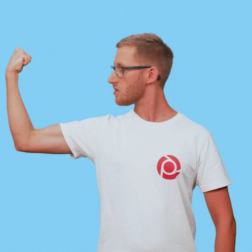 a man in a white t-shirt with a red circle on it