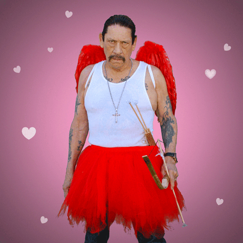A Man In A White Tank Top And A Red Skirt Is Holding An Arrow GIF