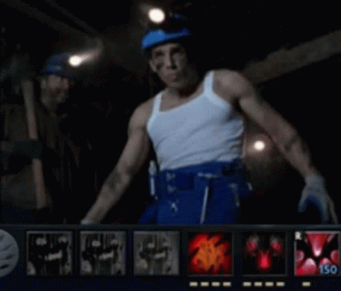 A Man In A White Tank Top And Blue Pants Is Standing In Front Of A Screen That Says 150 GIF