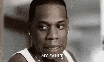 A Man In A White Tank Top Is Making A Funny Face . GIF