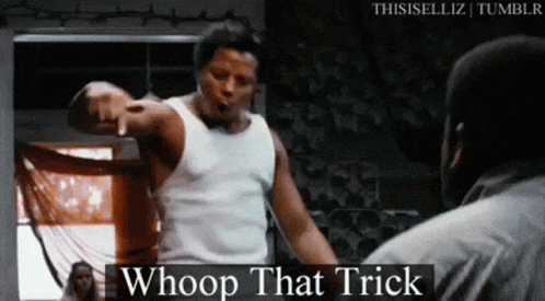 A Man In A White Tank Top Is Pointing At Another Man In A Black Shirt . GIF