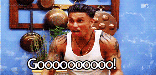 A Man In A White Tank Top Is Screaming In A Kitchen And Says Gooooooo ! GIF