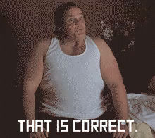 A Man In A White Tank Top Is Sitting On A Bed With The Words That Is Correct Behind Him GIF