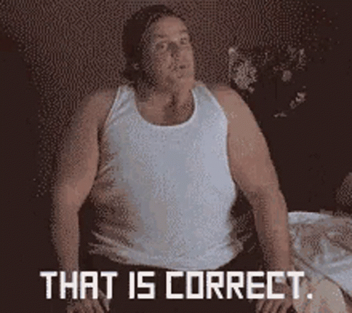 A Man In A White Tank Top Is Sitting On A Bed With The Words That Is Correct Written On The Bottom GIF