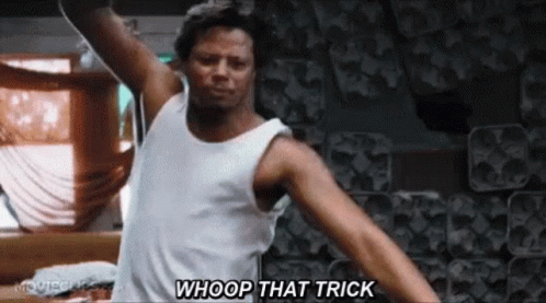 A Man In A White Tank Top Is Standing In A Room With His Arms Outstretched And Saying `` Whoop That Trick '' . GIF