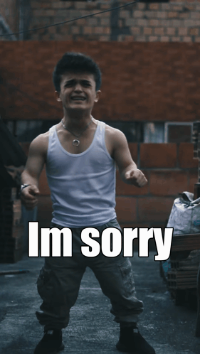 A Man In A White Tank Top Is Standing In Front Of A Brick Wall With The Words " Dont Leave Me " Above Him GIF