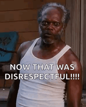 a man in a white tank top is standing in front of a window and says `` now that was disrespectful '' .