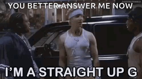 A Man In A White Tank Top Is Standing Next To A Car And Talking To Two Other Men . GIF