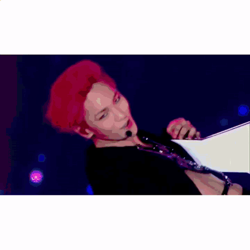 A Man In A White Tank Top Is Walking Down A Hallway With Nylon Tv Korea Written On The Bottom GIF