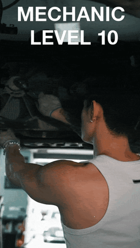 A Man In A White Tank Top Is Working Underneath A Car With The Words Mechanic Level 10 Behind Him GIF