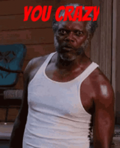 A Man In A White Tank Top Says You Crazy In Red GIF