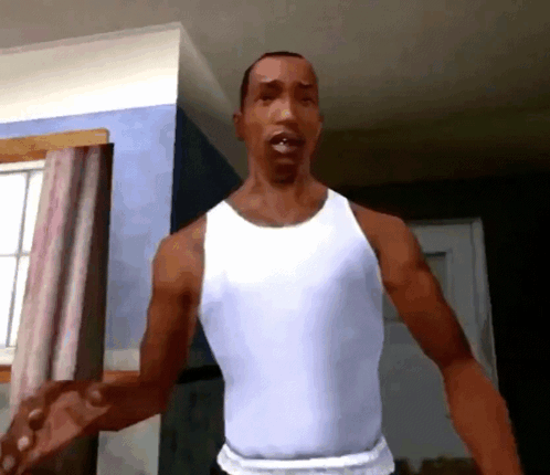 A Man In A White Tank Top Stands In A Room With His Arms Outstretched GIF