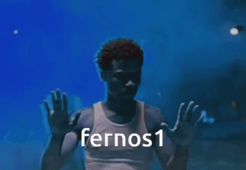 A Man In A White Tank Top With Fernos1 Written On The Bottom GIF