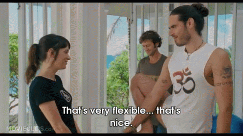 A Man In A White Tank Top With The Number 35 On It Is Talking To A Woman GIF