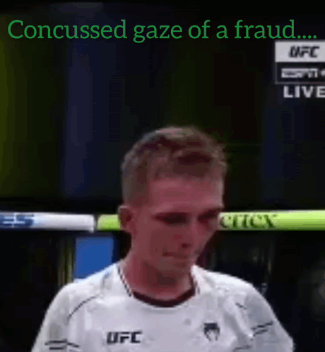 A Man In A White Ufc Shirt Is Crying On A Tv Screen GIF