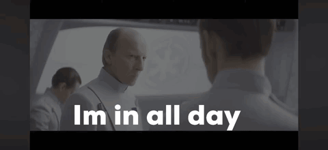 A Man In A White Uniform Is Talking To Another Man And The Words I 'M In All Day Are Above Him . GIF