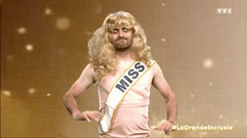 A Man In A Wig And Sash That Says Miss GIF