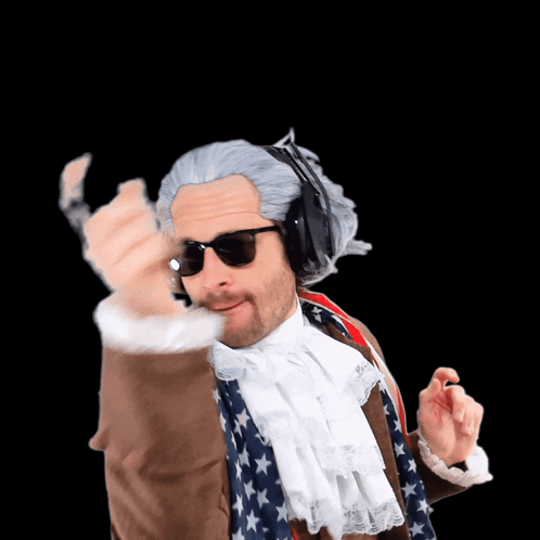 A Man In A Wig And Sunglasses Is Wearing Headphones And An American Flag Scarf GIF