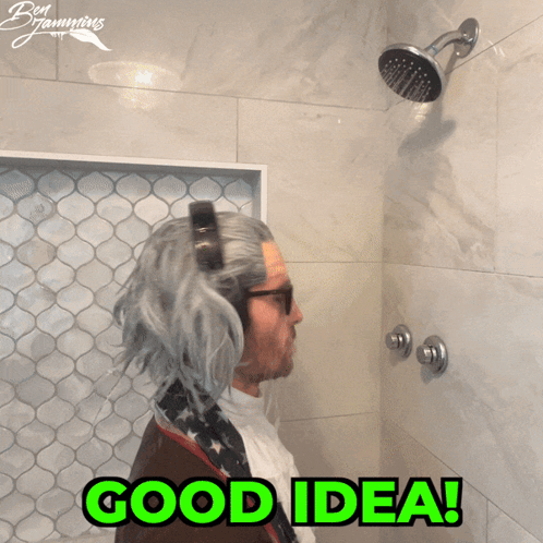 A Man In A Wig Is Taking A Shower With The Words Good Idea Written In Green GIF