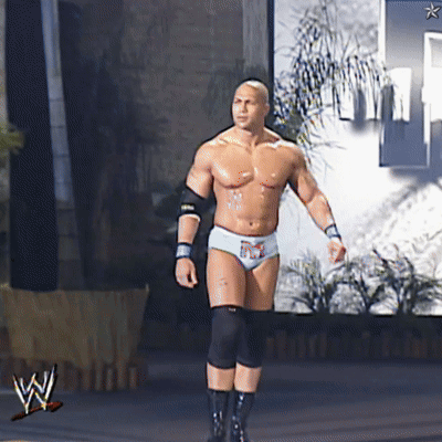 a man in a wrestling outfit is walking in front of a wwe logo