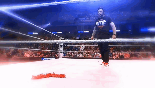 A Man In A Wrestling Ring Wearing A T-Shirt That Says Gtc GIF