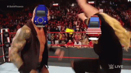 A Man In A Wrestling Ring With A Car On His Head GIF