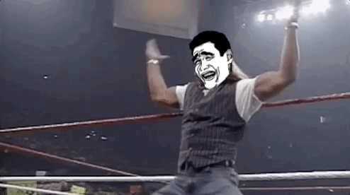 A Man In A Wrestling Ring With A Cartoon Face On His Face . GIF