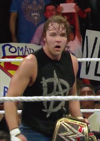 A Man In A Wrestling Ring With A Sign That Says Romad GIF