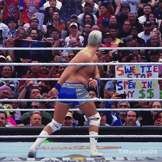 A Man In A Wrestling Ring With A Sign That Says Sweetie Stap Spending My $$ GIF
