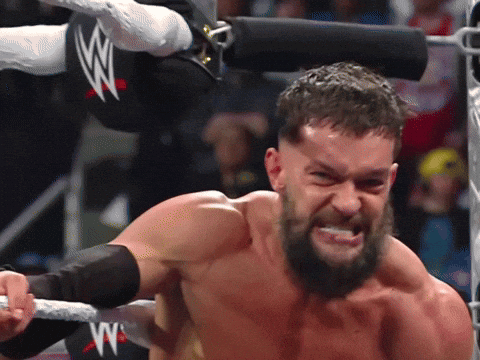A Man In A Wrestling Ring With A W Logo GIF
