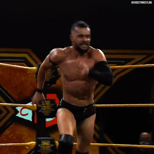 A Man In A Wrestling Ring With The Hashtag Choccywrestling On The Bottom GIF