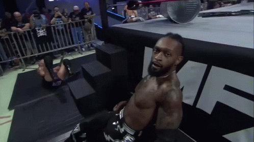 A Man In A Wrestling Ring With The Letter N On His Pants GIF