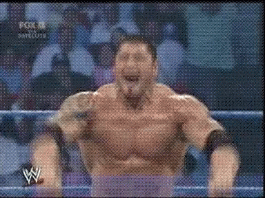 A Man In A Wrestling Ring With The Letter W On The Bottom Right GIF