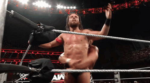 A Man In A Wrestling Ring With The Letters Aw On The Bottom GIF