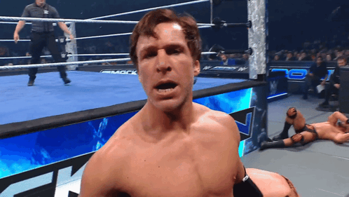 A Man In A Wrestling Ring With The Word Mack On The Side GIF