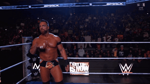 A Man In A Wrestling Ring With The Word Yeah On His Chest GIF