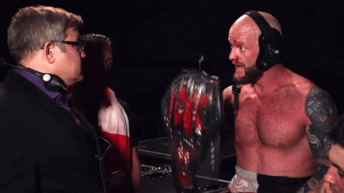A Man In A Wrestling Ring With The Words I 'M The King Of The Mountain Around Here Below Him GIF