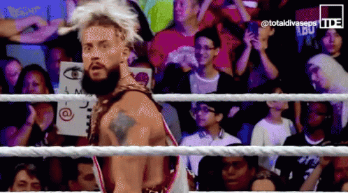 a man in a wrestling ring with the words totaldivaseps on the bottom right