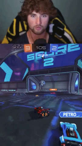 a man in a yellow and black shirt is playing a video game
