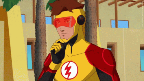 A Man In A Yellow And Red Superhero Costume Has A Lightning Bolt On His Chest GIF