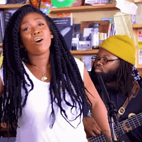 Man In Yellow Hat Playing Guitar Dreadlocks Woman GIF